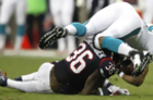 Low Blows: NFL Players Say New Fines Put Knees at Risk